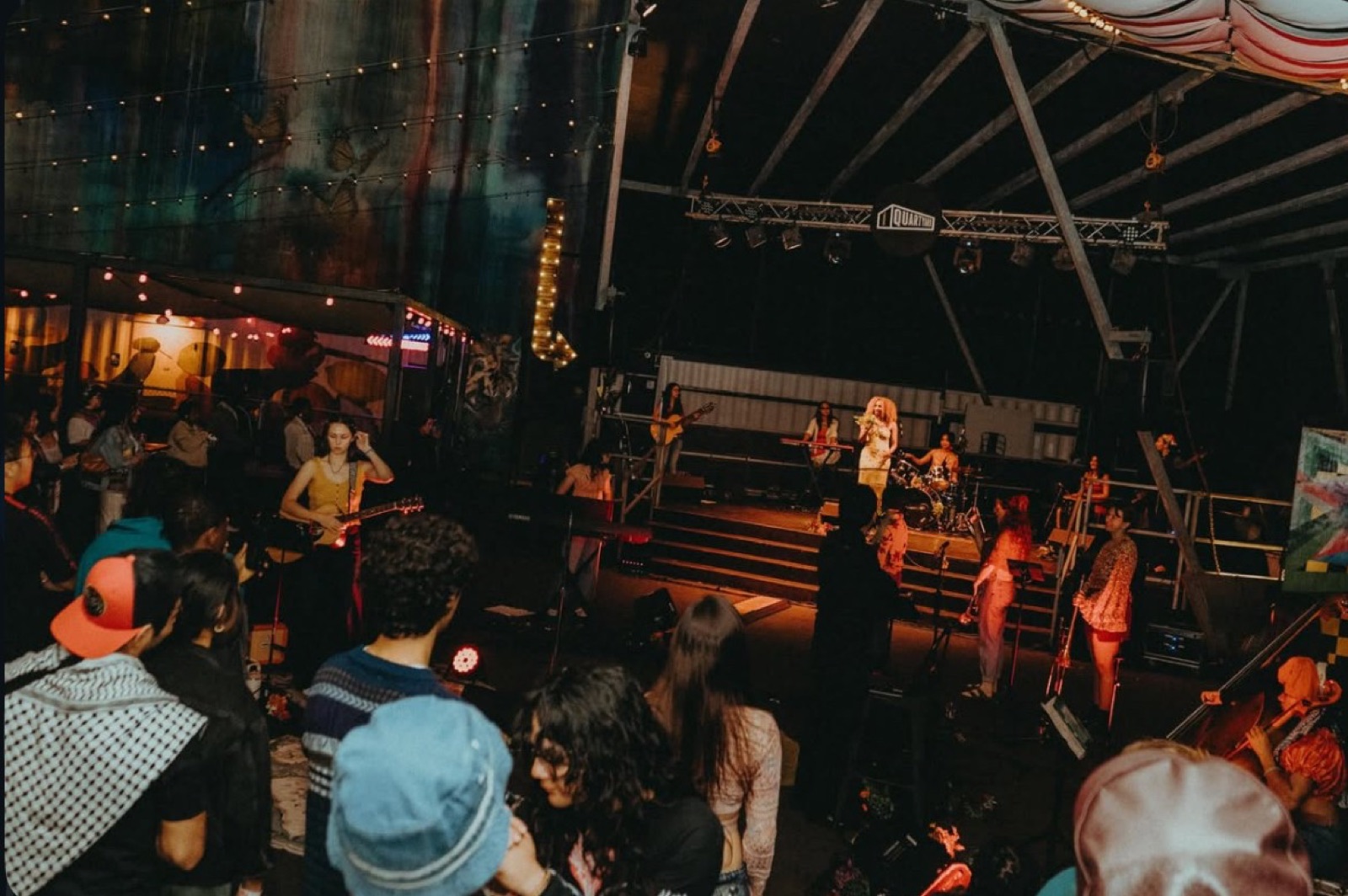 Nicole Hernandez performing Layers Reimagined live at Quartyard in San Diego with an all-women band and string players
